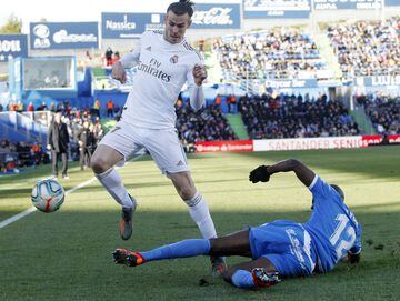 Gareth Bale skips over a challenge from Getafe's Nyom.
