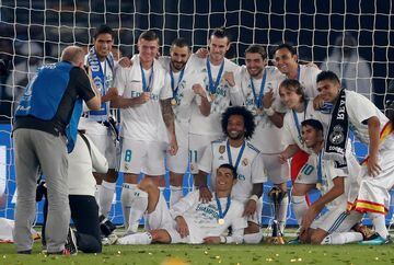 Real Madrid players celebrate with the trophy after winning the FIFA Club World Cup