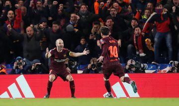 Lionel Messi celebrates with Andres Iniesta after scoring their first goal.