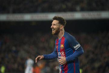 Messi celebrates scoring Barcelona's fourth goal against Espanyol on Sunday.