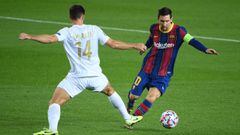 Ferencvaros midfielder Ihor Kharatin challenges Barcelona&#039;s Lionel Messi. 