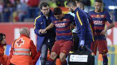 Luis Su&aacute;rez is assited after being injured. 