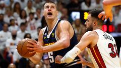 Nikola Jokic #15 of the Denver Nuggets drives to the basket against Max Strus #31 of the Miami Heat