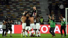 Qatar&#039;s players celebrate their victory with Qatar&#039;s coach Felix Sanchez (C-top) during the 2019 AFC Asian Cup quarter-final football match between South Korea and Qatar at Zayed Sports City in Abu Dhabi on January 25, 2019. (Photo by Khaled DES