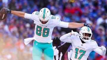 ORCHARD PARK, NEW YORK - JANUARY 15: Mike Gesicki #88 of the Miami Dolphins celebrates after scoring a touchdown with teammate Jaylen Waddle #17 during the second quarter against the Buffalo Bills in the AFC Wild Card playoff game at Highmark Stadium on January 15, 2023 in Orchard Park, New York.   Bryan M. Bennett/Getty Images/AFP (Photo by Bryan M. Bennett / GETTY IMAGES NORTH AMERICA / Getty Images via AFP)
