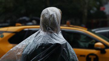 A person wears a rain poncho during wet weather in New York City, U.S., September 26, 2023.  REUTERS/Shannon Stapleton