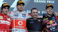 CAMPEÓN DEL MUNDO. El podio del GP de Japón, con Alonso orgulloso del segundo puesto, Button encantado con la victoria y Vettel, campeón mundial de F-1 2011.