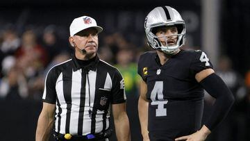 LAS VEGAS, NEVADA - JANUARY 09: Referee Clete Blakeman waits for quarterback Derek Carr #4 of the Las Vegas Raiders to call a timeout with two seconds left in overtime of a game against the Los Angeles Chargers at Allegiant Stadium on January 9, 2022 in Las Vegas, Nevada. Kicker Daniel Carlson #2 of the Raiders made a 47-yard field goal after the timeout to defeat the Chargers 35-32.   Ethan Miller/Getty Images/AFP == FOR NEWSPAPERS, INTERNET, TELCOS &amp; TELEVISION USE ONLY ==