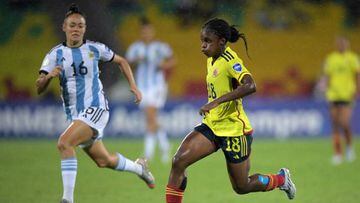 vColombia's Linda Caicedo (R) and Argentina's Marina Delgado vie for the ball during their Conmebol 2022 women's Copa America football tournament semifinal match at the Alfonso Lopez stadium in Bucaramanga, Colombia, on July 25, 2022. (Photo by Raul ARBOLEDA / AFP) (Photo by RAUL ARBOLEDA/AFP via Getty Images)