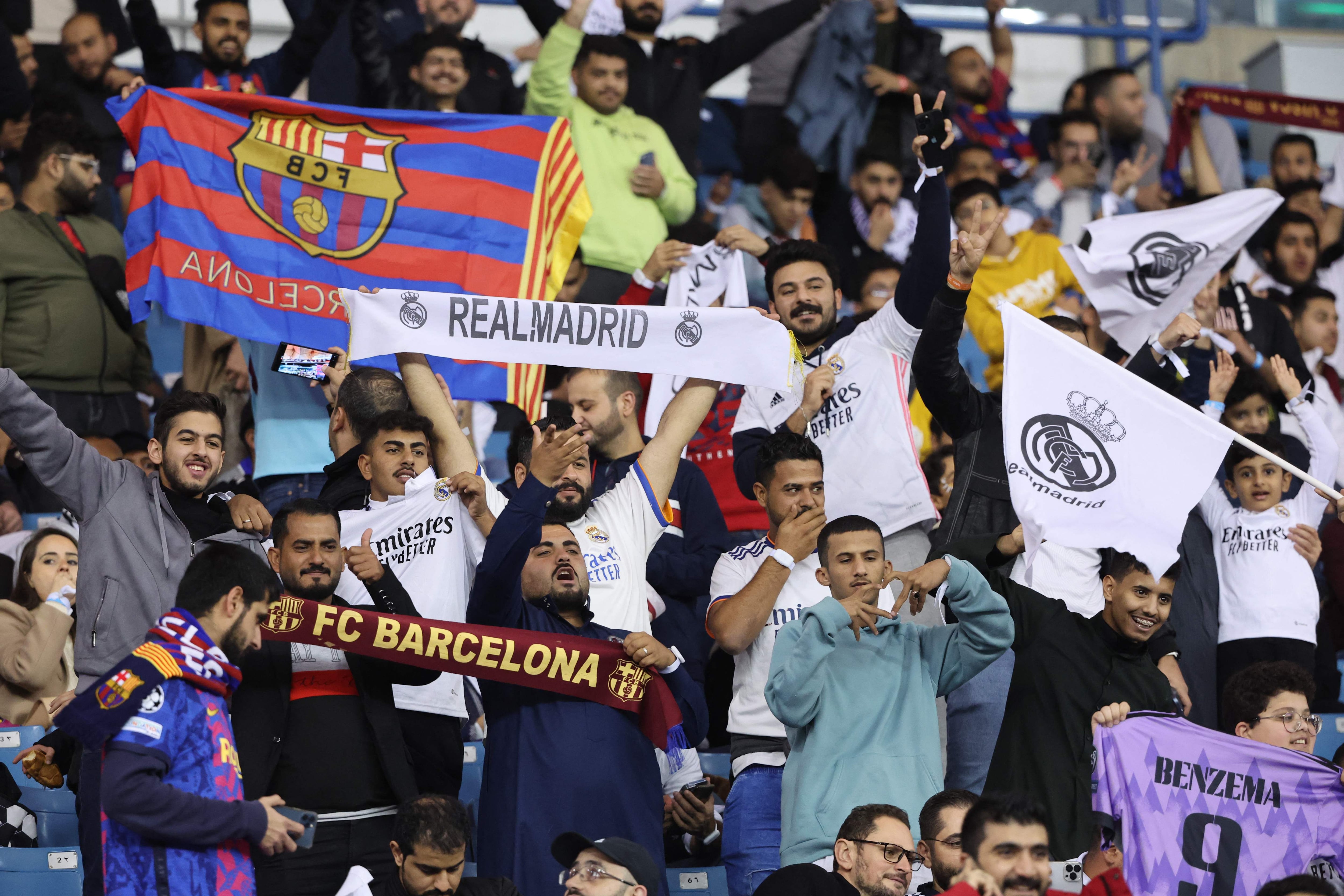 Supporters cheer before the start of the Spanish Super Cup final football match between Real Madrid CF and FC Barcelona at the King Fahd International Stadium in Riyadh, Saudi Arabia, on January 15, 2023. (Photo by Giuseppe CACACE / AFP)