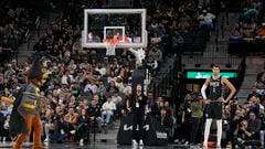 San Antonio Spurs forward Victor Wembanyama (1) watches Spurs mascot Coyote chasing a bat during the first half of the game against the Minnesota Timberwolves at Frost Bank Center.