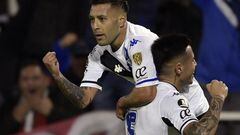 Velez Sarsfield's Lucas Janson (Top) celebrates with teammate Francisco Ortega after scoring against Talleres de Cordoba during the Copa Libertadores football tournament quarterfinals all-Argentine first leg match at the Jose Amalfitani stadium in Buenos Aires, on August 3, 2022. (Photo by JUAN MABROMATA / AFP)