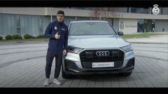 Real Madrid players pose for the cameras with their new club cars