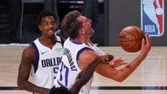 LAKE BUENA VISTA, FLORIDA - AUGUST 17: Patrick Beverley #21 of the LA Clippers fouls Luka Doncic #77 of the Dallas Mavericks during the second quarter in Game One of the Western Conference First Round during the 2020 NBA Playoffs at AdventHealth Arena at 