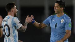 Argentina&#039;s Lionel Messi (L) greets Uruguay&#039;s Luis Suarez before the start of the South American qualification football match for the FIFA World Cup Qatar 2022, at the Monumental stadium in Buenos Aires, on October 10, 2021. (Photo by Juan Mabro