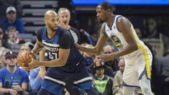 Mar 11, 2018; Minneapolis, MN, USA; Minnesota Timberwolves forward Taj Gibson (67) looks to pass the ball around Golden State Warriors forward Kevin Durant (35) in the first half at Target Center. Mandatory Credit: Jesse Johnson-USA TODAY Sports