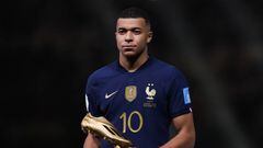 LUSAIL CITY, QATAR - DECEMBER 18: Kylian Mbappe of France reacts with the Golden Boot award after the FIFA World Cup Qatar 2022 Final match between Argentina and France at Lusail Stadium on December 18, 2022 in Lusail City, Qatar. (Photo by Alex Livesey - Danehouse/Getty Images)