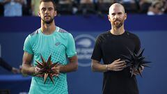 WINSTON SALEM, NORTH CAROLINA - AUGUST 27: Champion Adrian Mannarino (R) of France poses with finalist Laslo Djere of Serbia following the men's singles championship final on day eight of the Winston-Salem Open at Wake Forest Tennis Complex on August 27, 2022 in Winston Salem, North Carolina.   Jared C. Tilton/Getty Images/AFP
== FOR NEWSPAPERS, INTERNET, TELCOS & TELEVISION USE ONLY ==