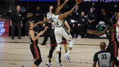 Milwaukee Bucks&#039; Giannis Antetokounmpo (34) goes up for a shot in front of Miami Heat&#039;s Duncan Robinson (55) in the second half of an NBA conference semifinal playoff basketball game Friday, Sept. 4, 2020, in Lake Buena Vista, Fla. (AP Photo/Mar