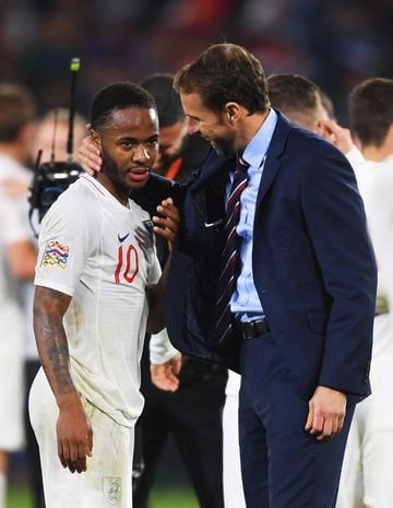 SEVILLE, SPAIN - OCTOBER 15:  Gareth Southgate, Manager of England and Raheem Sterling of England celebrate victory after the UEFA Nations League A Group Four match between Spain and England at Estadio Benito Villamarin on October 15, 2018 in Seville, Spa