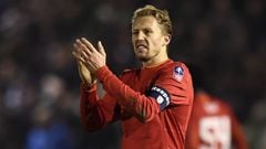 Liverpool&#039;s Lucas Leiva applauds fans after the game