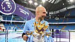 MANCHESTER, ENGLAND - MAY 23: Pep Guardiola, Manager of Manchester City celebrates with the Premier League Trophy as Manchester City are presented with the Trophy as they win the league following during the Premier League match between Manchester City and