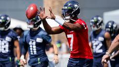 Seattle Seahawks quarterback Geno Smith (7) participates in a drill during training camp practice at Virginia Mason Athletic Center.