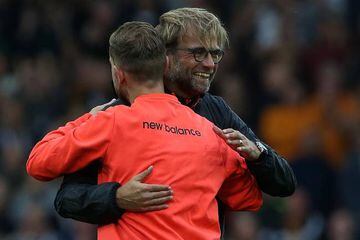 Klopp (right) hugs Liverpool's Jordan Henderson after the Reds' win over Hull.