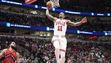 Mar 21, 2022; Chicago, Illinois, USA; Chicago Bulls forward DeMar DeRozan (11) goes up for a dunk against the Toronto Raptors  during the first quarter at United Center. Mandatory Credit: David Banks-USA TODAY Sports
