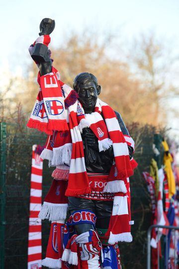 A statue of Stoke City and England's former goalkeeper Gordon Banks is pictured draped in scarves to honour England's World Cup winning goalkeeper, outside the Bet365 stadium in Stoke-on-Trent.