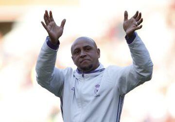 Roberto Carlos applauds the fans at Anfield.