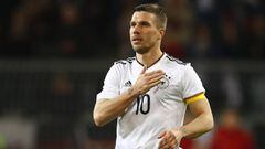 Germany&#039;s Lukas Podolski acknowledges fans as he walks off to be substituted