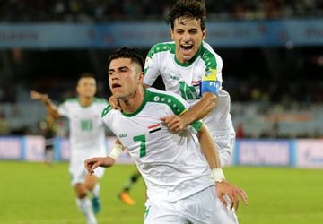 Mohammed Dawood (front) celebrates with Mohammed Ridha after putting Iraq ahead against Mexico.
