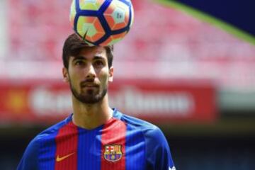 New Barcelona's Portuguesse forward Andre Gomes looks at a ball during his official presentation at the Camp Nou stadium in Barcelona on July 27, 2016, after signing his new contract with the Catalan club. 