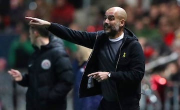 Pep Guardiola issues instructions to his Manchester City players.