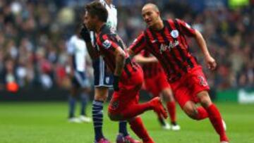 WEST BROMWICH, ENGLAND - APRIL 04:  Eduardo Vargas of QPR celebrates scoring the opening goal with Bobby Zamora of QPR during the Barclays Premier league match West Bromwich Albion and Queens Park Rangers at The Hawthorns on April 4, 2015 in West Bromwich, England.  (Photo by Matthew Lewis/Getty Images)