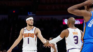 Apr 2, 2023; Oklahoma City, Oklahoma, USA; Phoenix Suns guard Devin Booker (1) and guard Chris Paul (3) high five during the second half against the Oklahoma City Thunder at Paycom Center. Phoenix won 128-118. Mandatory Credit: Alonzo Adams-USA TODAY Sports