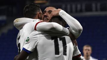 Lyon's players celebrate after scoring a goal during the French Cup round-of-32 football match between Lyon (OL) and Sochaux (FCSM) at The Groupama Stadium in Decines-Charpieu, near Lyon, central-eastern France on March 6, 2021. (Photo by JEAN-PHILIP