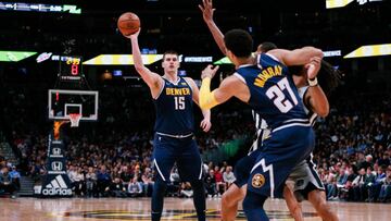 Apr 3, 2019; Denver, CO, USA; Denver Nuggets center Nikola Jokic (15) tries to pass to guard Jamal Murray (27) as he battles for position against San Antonio Spurs guard Patty Mills (8) in the second quarter at the Pepsi Center. Mandatory Credit: Isaiah J. Downing-USA TODAY Sports