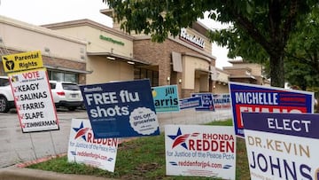 Campaign signs are posted, along with a free flu shot announcement, near a polling station in Round Rock, Texas on November 7, 2022, the eve of the midterm elections.. (Photo by SUZANNE CORDEIRO / AFP) (Photo by SUZANNE CORDEIRO/AFP via Getty Images)