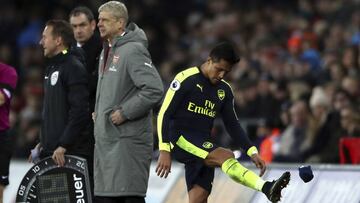 Arsenal's Alexis Sanchez shows his frustration at being substituted for Danny Welbeck during the English Premier League soccer match between Swansea City and Arsenal at the Liberty Stadium, Swansea, Wales, Saturday, Jan. 14, 2017.(Nick Potts/PA via A