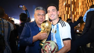 LUSAIL CITY, QATAR - DECEMBER 18: Lionel Scaloni, Head Coach of Argentina, celebrates with Claudio Tapia, President of the Argentine Football Association, after winning the FIFA World Cup on an open top bus outside the stadium during the FIFA World Cup Qatar 2022 Final match between Argentina and France at Lusail Stadium on December 18, 2022 in Lusail City, Qatar. (Photo by Michael Regan - FIFA/FIFA via Getty Images)