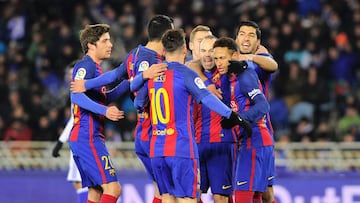 Barcelona's players celebrate after Brazilian forward Neymar scored his team's first goal during the Spanish Copa del Rey quarter final first leg football match Real Sociedad