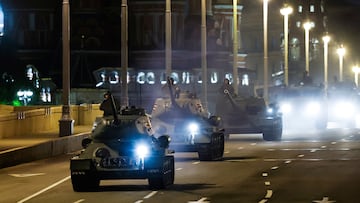 Historical T-34 tanks and a column of military vehicles drive across the bridge with the Saint Basil Cathedral seen in the background on the day of a rehearsal for a military parade, which marks the 80th anniversary of the victory over Nazi Germany in World War Two, in central Moscow, Russia, May 3, 2025. REUTERS/Maxim Shemetov