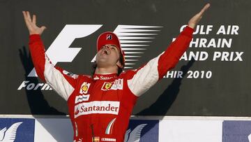 Ferrari Formula One driver Fernando Alonso of Spain celebrates after winning the Bahrain F1 Grand Prix at Sakhir circuit in Manama March 14, 2010. REUTERS/Ahmed Jadallah (Bahrain - Tags: SPORT MOTOR RACING)