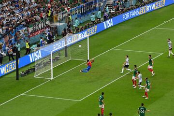 LUSAIL CITY, QATAR - NOVEMBER 26: Guillermo Ochoa of Mexico dives in vain as Enzo Fernandez (not pictured) of Argentina scores their team's second goal during the FIFA World Cup Qatar 2022 Group C match between Argentina and Mexico at Lusail Stadium on November 26, 2022 in Lusail City, Qatar. (Photo by Claudio Villa/Getty Images)