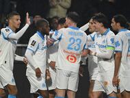 Marseille's players celebrate their team's second goal during the French L1 football match between SCO Angers and Olympique de Marseille (OM) at the Stade Raymond-Kopa in Angers, central Framce, on January 17, 2026. (Photo by JEAN-FRANCOIS MONIER / AFP)