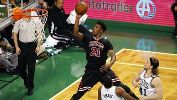 Apr 16, 2017; Boston, MA, USA; Chicago Bulls forward Jimmy Butler (21) goes to the basket past Boston Celtics guard Marcus Smart (36) and center Kelly Olynyk (41) during the third quarter in game one of the first round of the 2017 NBA Playoffs at TD Garden. Mandatory Credit: Winslow Townson-USA TODAY Sports