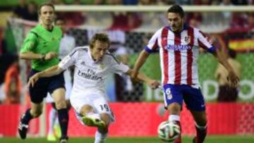 Modric y Koke.