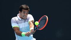 MELBOURNE, AUSTRALIA - JANUARY 16: Cristian Garin of Chile plays a backhand in their round one singles match against Sebastian Korda of the United States during day one of the 2023 Australian Open at Melbourne Park on January 16, 2023 in Melbourne, Australia. (Photo by Mackenzie Sweetnam/Getty Images)